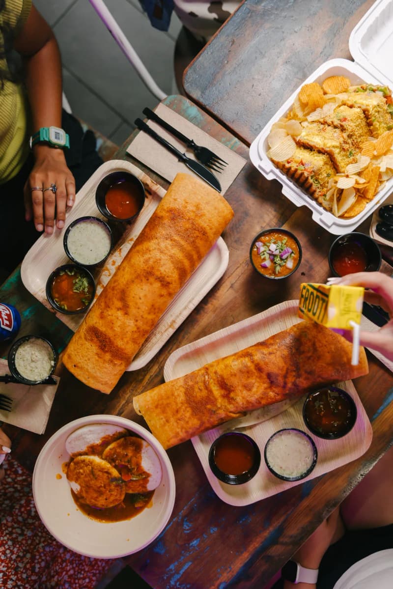 Madras Dosa Co dosas and chutneys on a table
