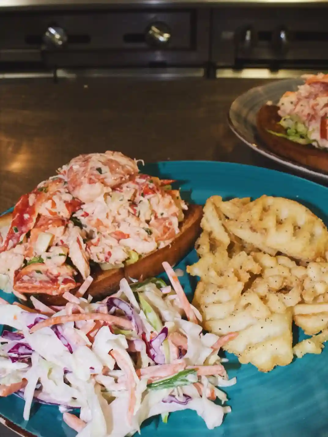 Lobster roll with coleslaw and house chips