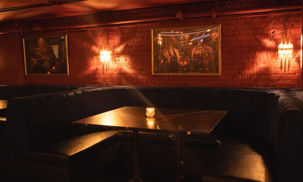 Candlelit lounge table ready for a reservation at The Addison, Midtown NYC