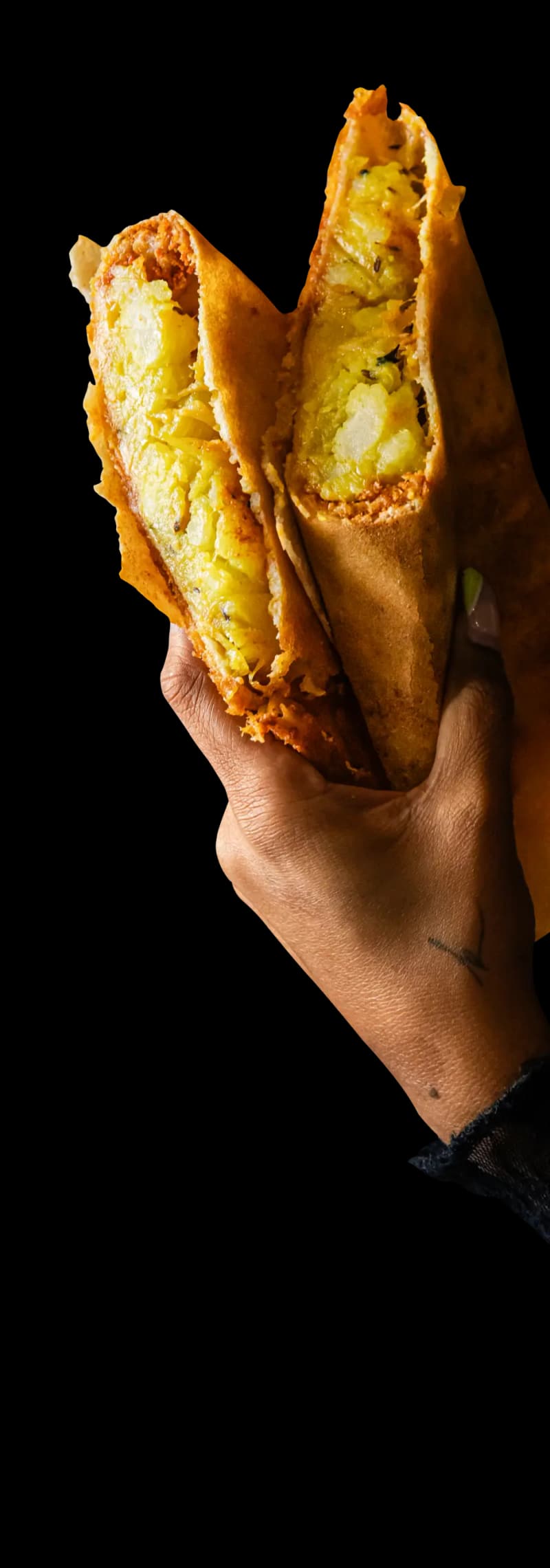 Dosa folded around spiced potato filling