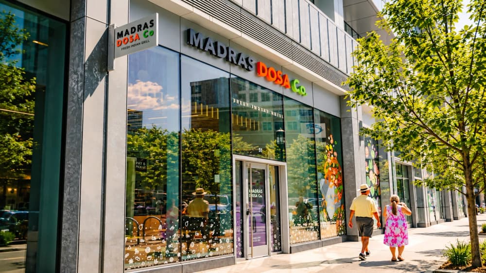 Madras Dosa Co storefront with the big Madras Dosa Co sign