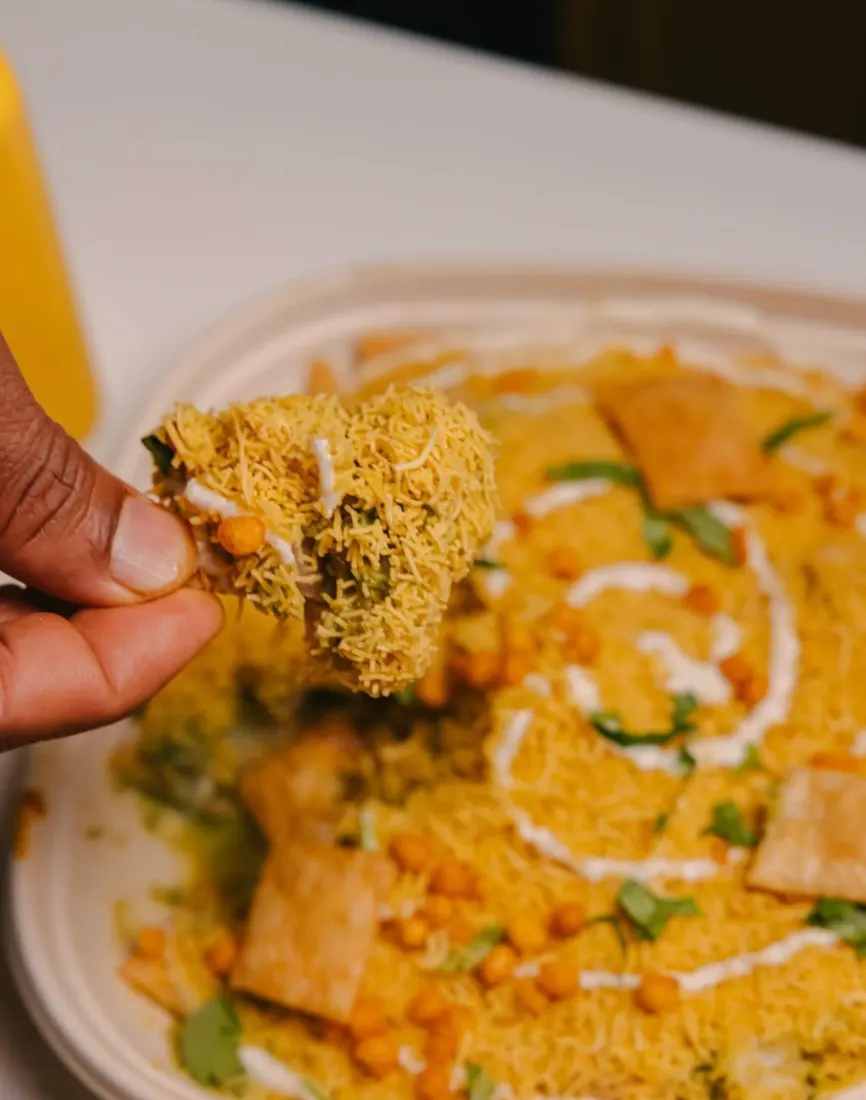 Papdi chaat topped with sev and chutneys