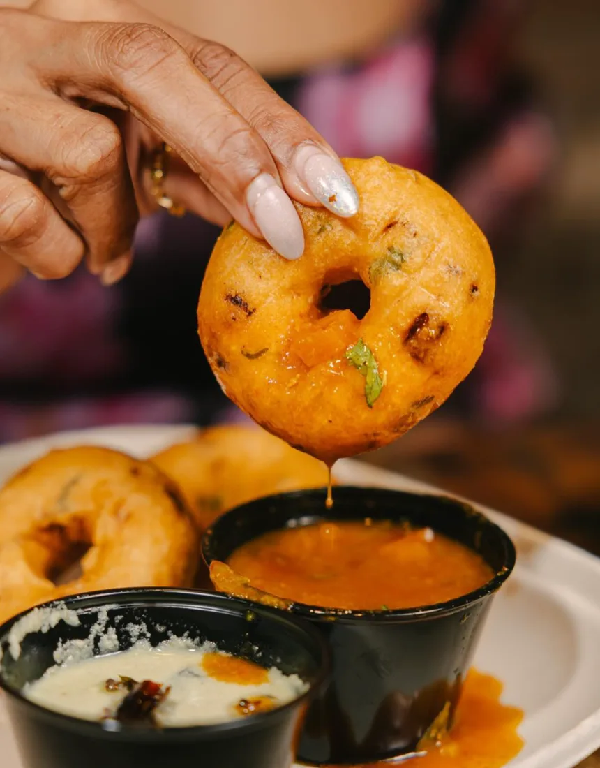 A vada dipped into sambar