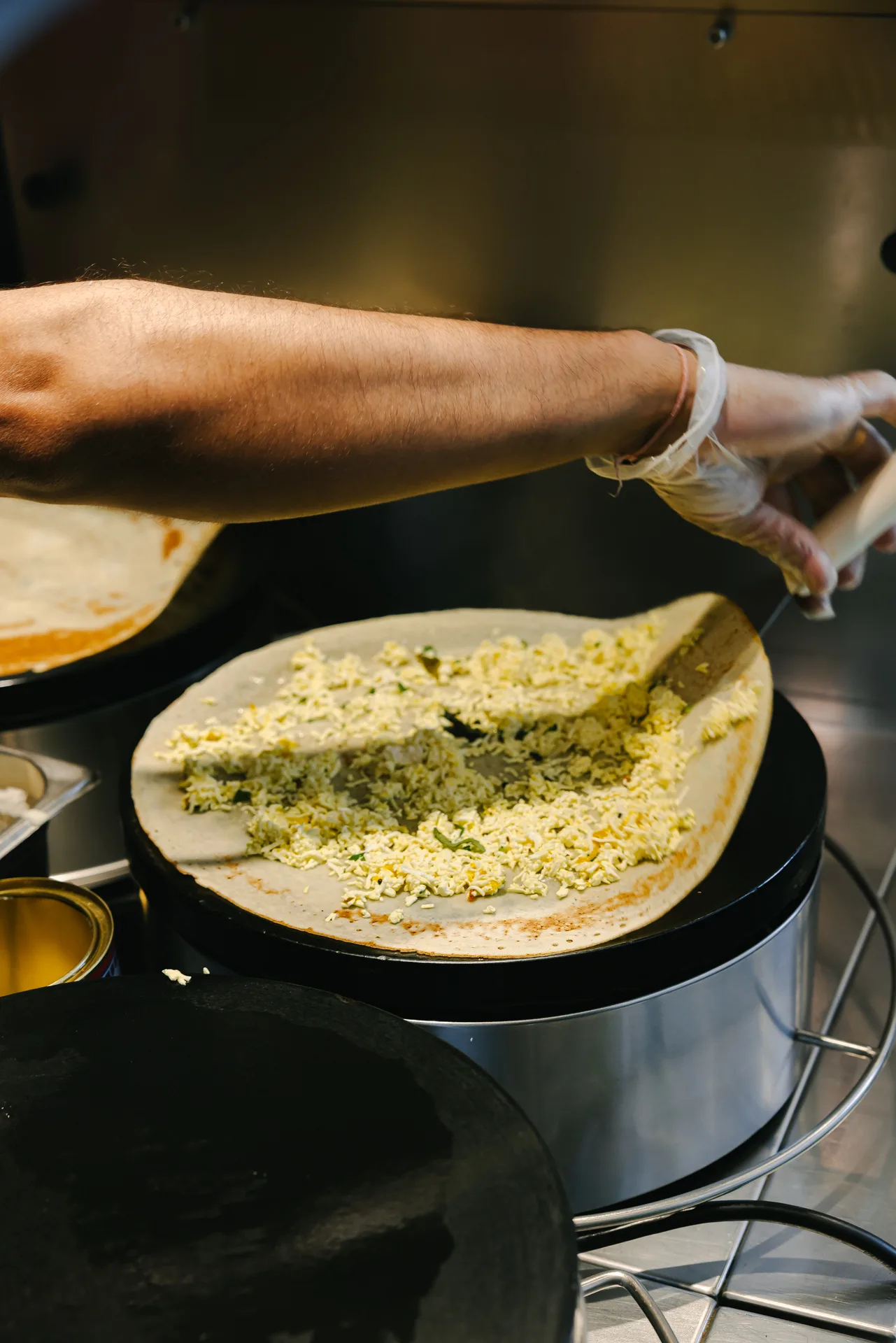 Crispy dosa with sambar and chutneys on a steel thali